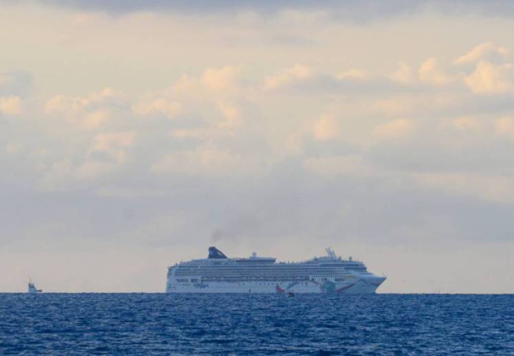 In this photo provided by the Royal Gazette, the Norwegian cruise ship Norwegian Dawn, lies aground near Bermuda's North Channel Tuesday, May 19, 2015. Thousands of passengers bound for Boston will spend Tuesday night stuck aboard a Norwegian cruise ship after it ran aground as it tried to depart Bermuda, officials and passengers said. (Akil Simmons/The Royal Gazette photo via AP) - BERMUDA OUT - NOT FOR USE IN BERMUDA PUBLICATIONS