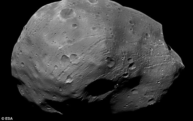 Martian moon: Taken by Europe's Mars Express probe earlier this month, this image has been photometrically enhanced to illuminate the darker areas of Phobos, one of the least reflective bodies in the solar system